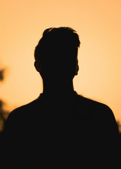 pexels-photo-5973136-5973136 Silhouette of a person against a vibrant sunset in Cumilla, Bangladesh.